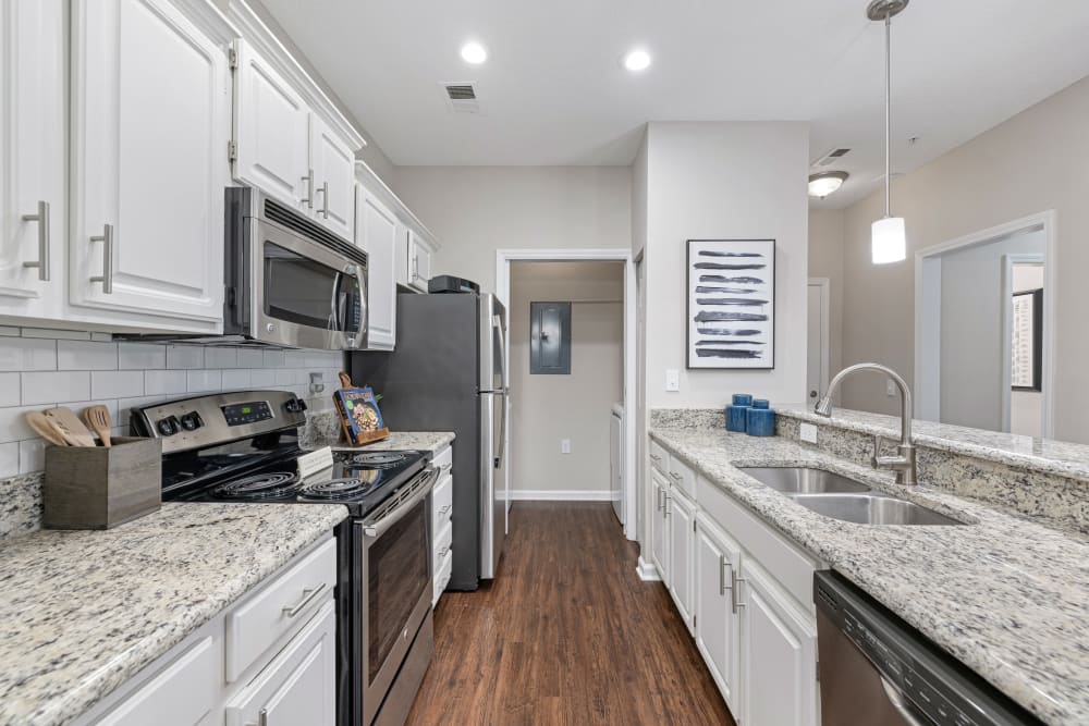 Modern kitchen with white cabinets at The Preserve at Ballantyne Commons in Charlotte, North Carolina