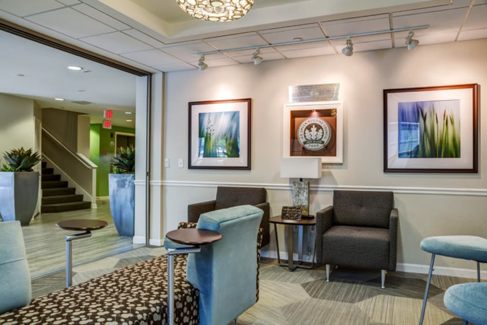 A well lit communal area with art hanging on the wall at Parkside Commons in Chelsea, Massachusetts 