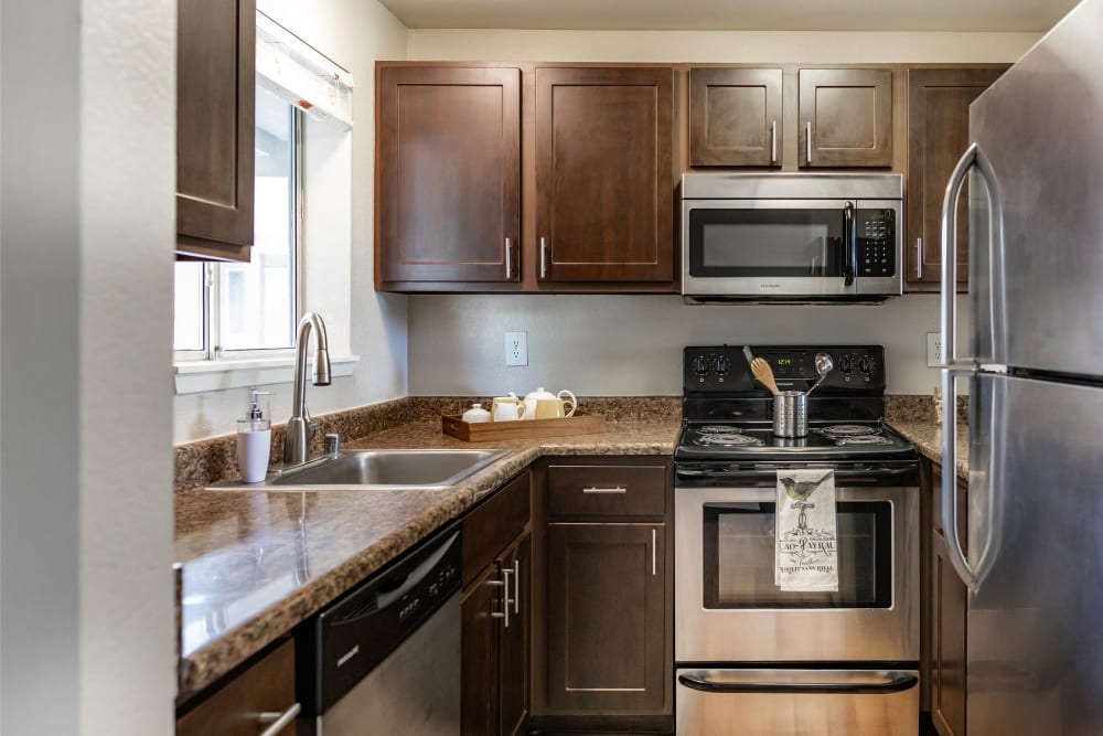 Granite-style counter tops in kitchens at Latitude Apartments in Everett, Washington