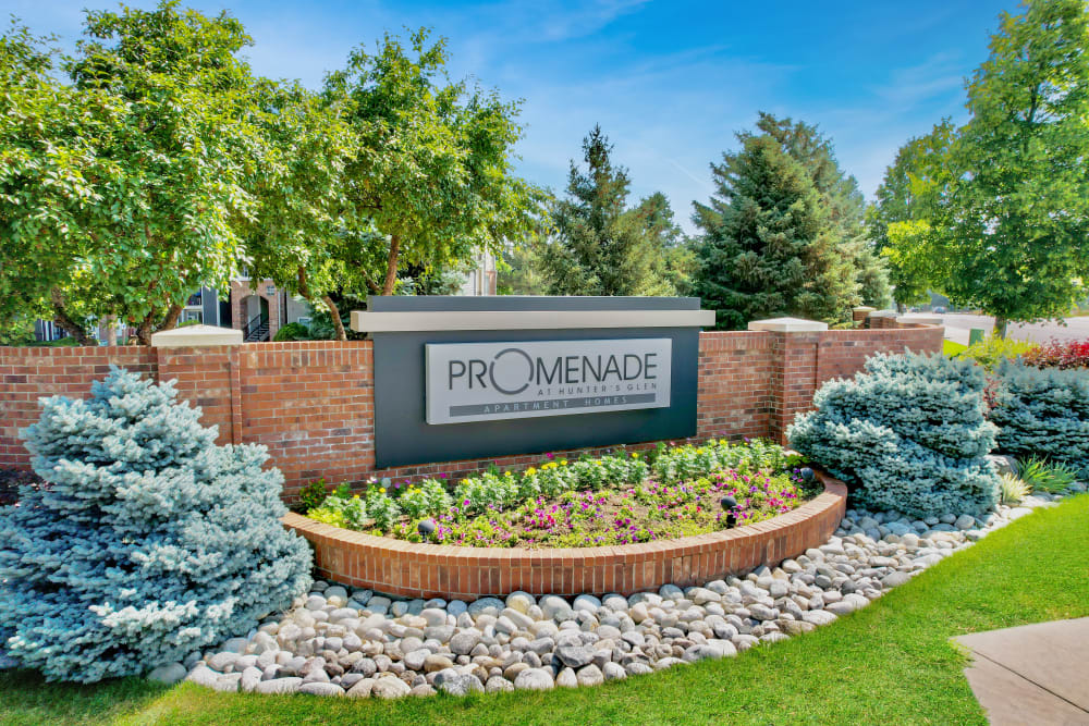 The front monument sign at Promenade at Hunter's Glen Apartments in Thornton, Colorado