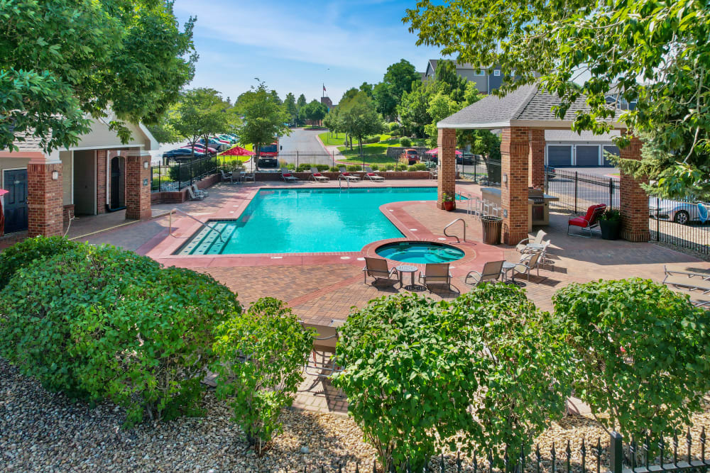 Beautiful resort-style swimming pool and spa at Promenade at Hunter's Glen Apartments in Thornton, Colorado