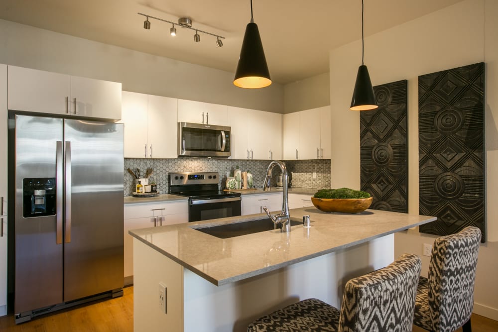 Kitchen with stainless-steel appliances at Olympus de Santa Fe, Santa Fe, New Mexico 