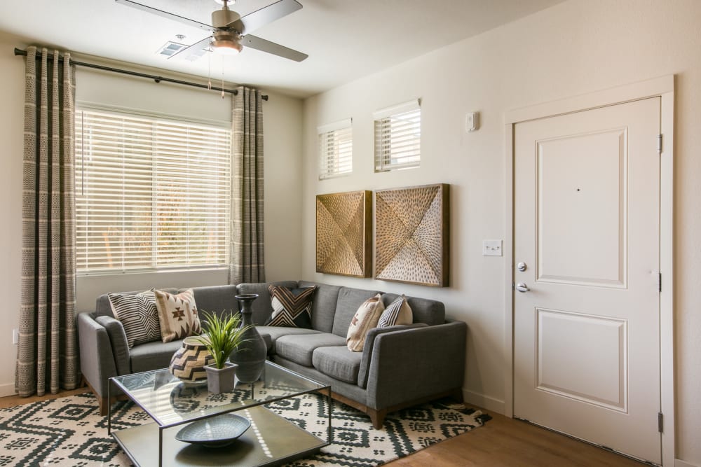 Well lit living area with large window at Olympus de Santa Fe, Santa Fe, New Mexico 