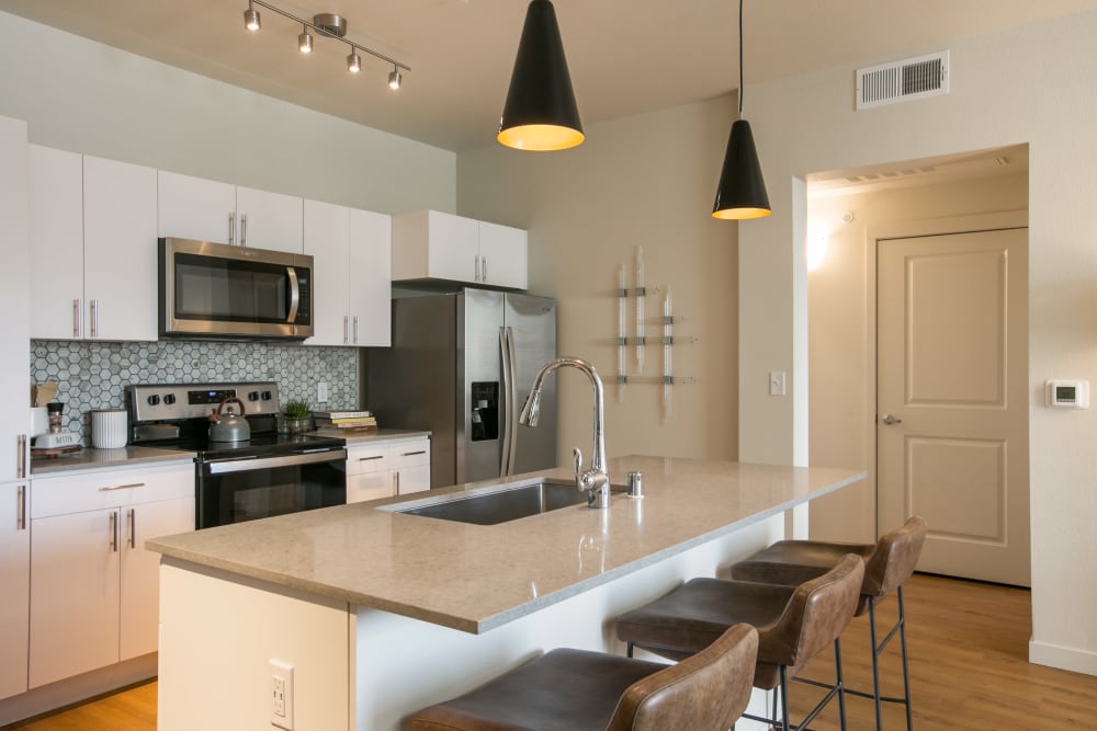 Kitchen with stainless-steel appliances at Olympus de Santa Fe, Santa Fe, New Mexico