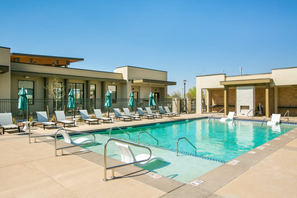 Resort style pool with lounge chairs and cabanas at Olympus de Santa Fe, Santa Fe, New Mexico 