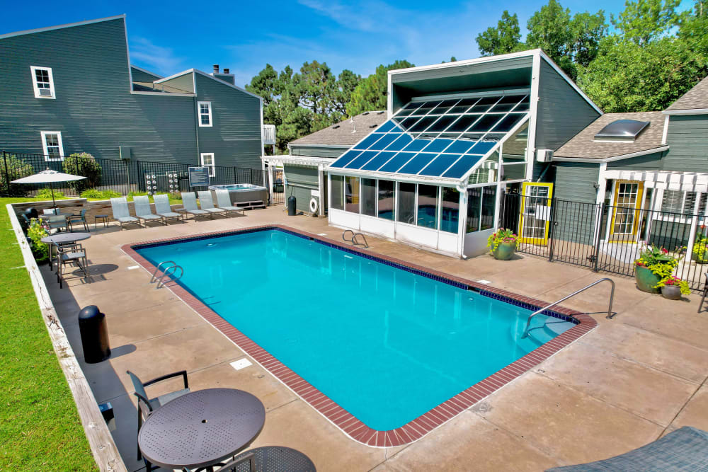 Beautiful resort-style swimming pool at sunset at Bluesky Landing Apartments in Lakewood, Colorado