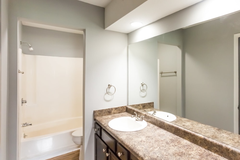 Bathroom with granite countertops at Northshore Flats Apartments in Chattanooga, Tennessee
