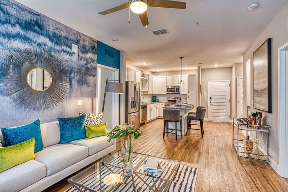 Spacious living room and kitchen at The Parker at Maitland Station in Maitland, Florida