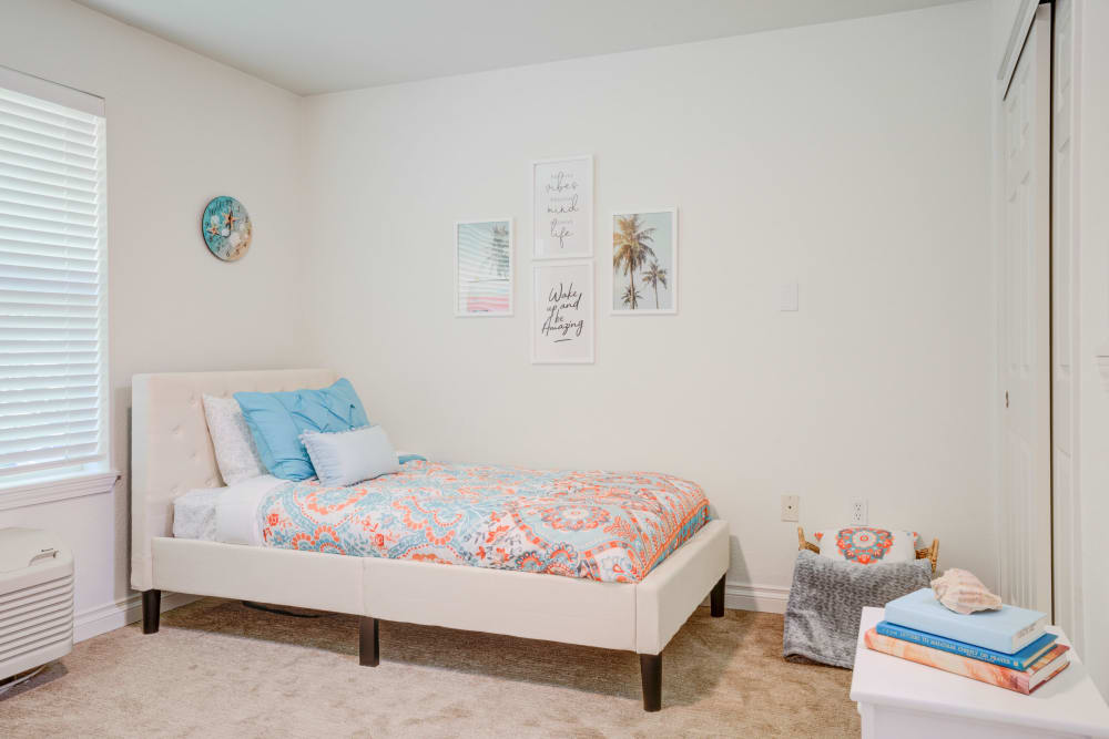 Well lit model bedroom at Evergreen Senior Living in Eugene, Oregon.