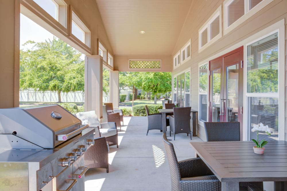 BBQ area with outdoor seating at Evergreen Senior Living in Eugene, Oregon. 