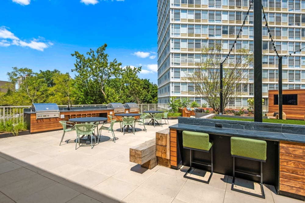 Second Floor Roof Deck at The Hub at Prairie Shores Bronzeville, Grills at The Hub at Prairie Shores Apartments in Chicago Illinois, Chicago Illinois Rooftop Amenities, Bronzeville Rooftop Apartment Amenities