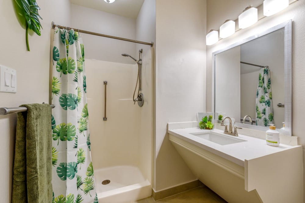 Model bathroom with a step in shower at Pacifica Senior Living Belleair in Clearwater, Florida