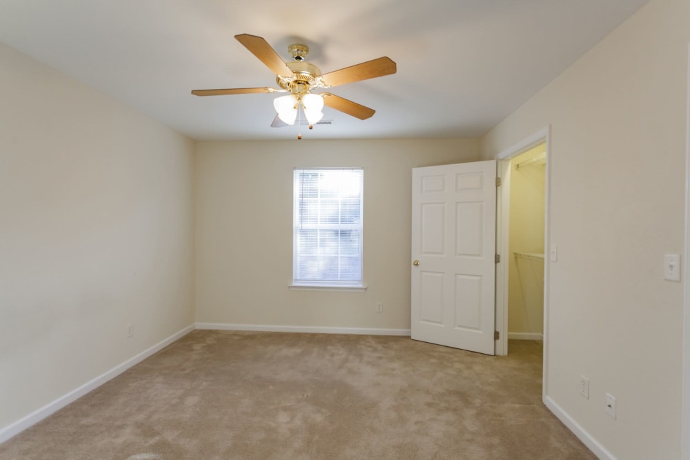 Bedroom with ceiling fan at Home Place Apartments in East Ridge, Tennessee