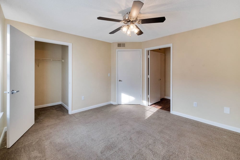 Bedroom with walk in closet at The Cove at Cloud Springs Apartment Homes in Fort Oglethorpe, Georgia