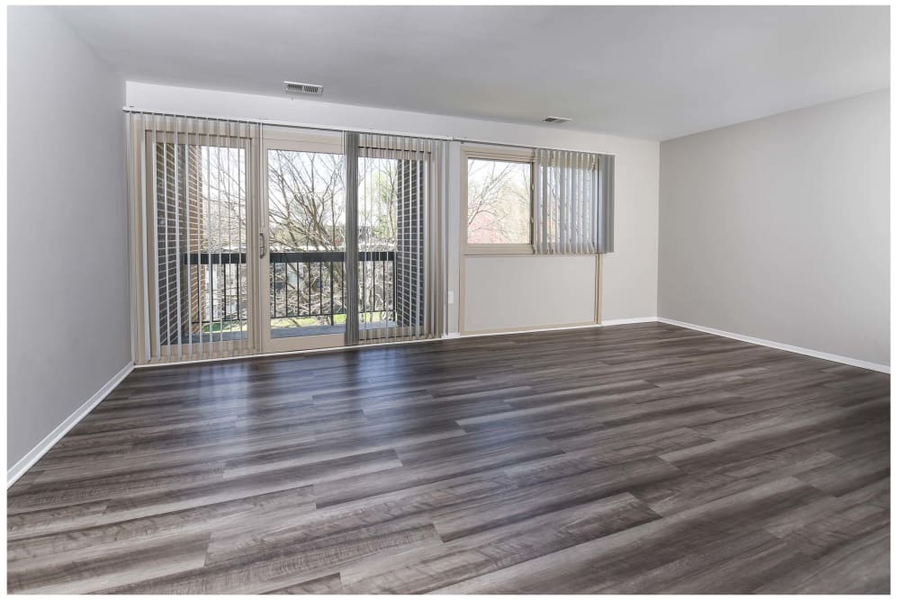 Open floor plan with wood style flooring at Landmark Glenmont Station in Silver Spring, Maryland