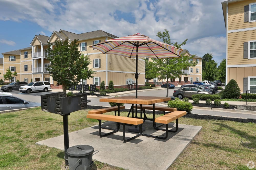 Picnic table with an umbrella at Sage Creek Apartments in Augusta, Georgia