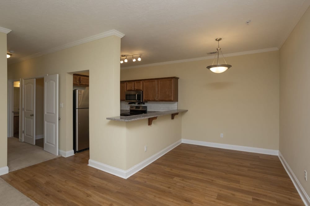 Kitchen with hardwood style  floors at Sage Creek Apartments in Augusta, Georgia
