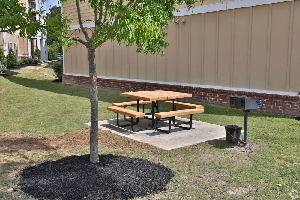 Picnic table and grilling station at Sage Creek Apartments in Augusta, Georgia
