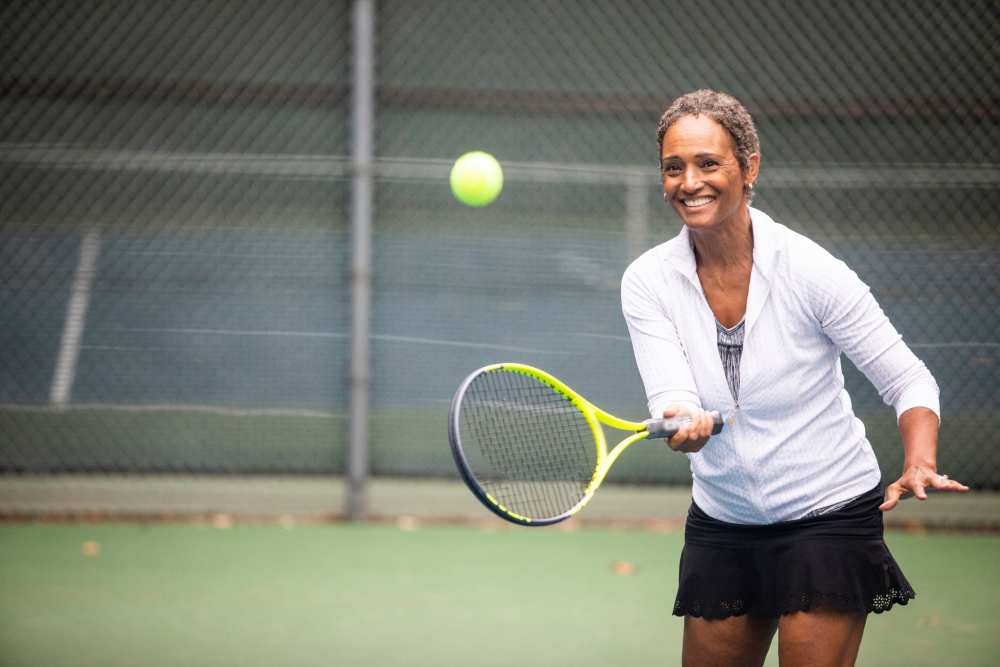Woman playing tennis at Corp Site Testing in Bend, Oregon