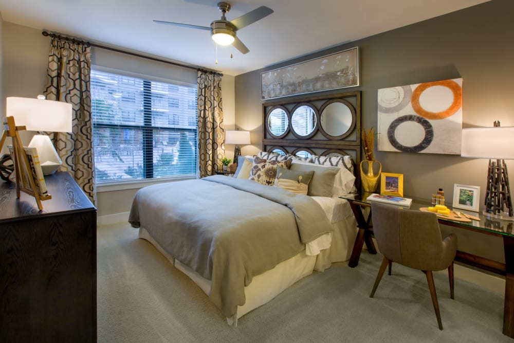 Bedroom with large windows at Reserve at the Ballpark in Atlanta, Georgia