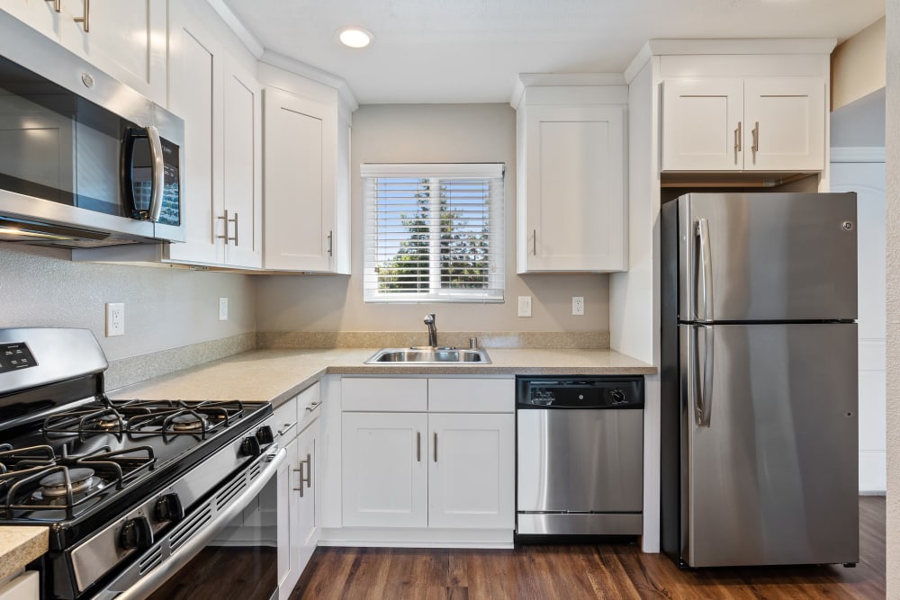Sparkling kitchen with updated appliances at Pinebrook Apartment Homes in Fremont, California