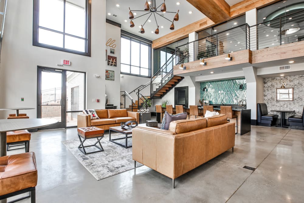 Upscale community center with leather furniture and polished concrete floors. 