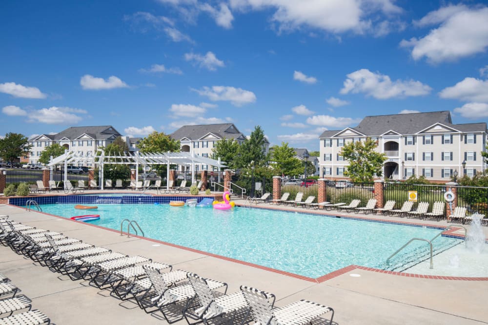 Lounge chairs by the pool at The Greens at Sunchase in Farmville, Virginia