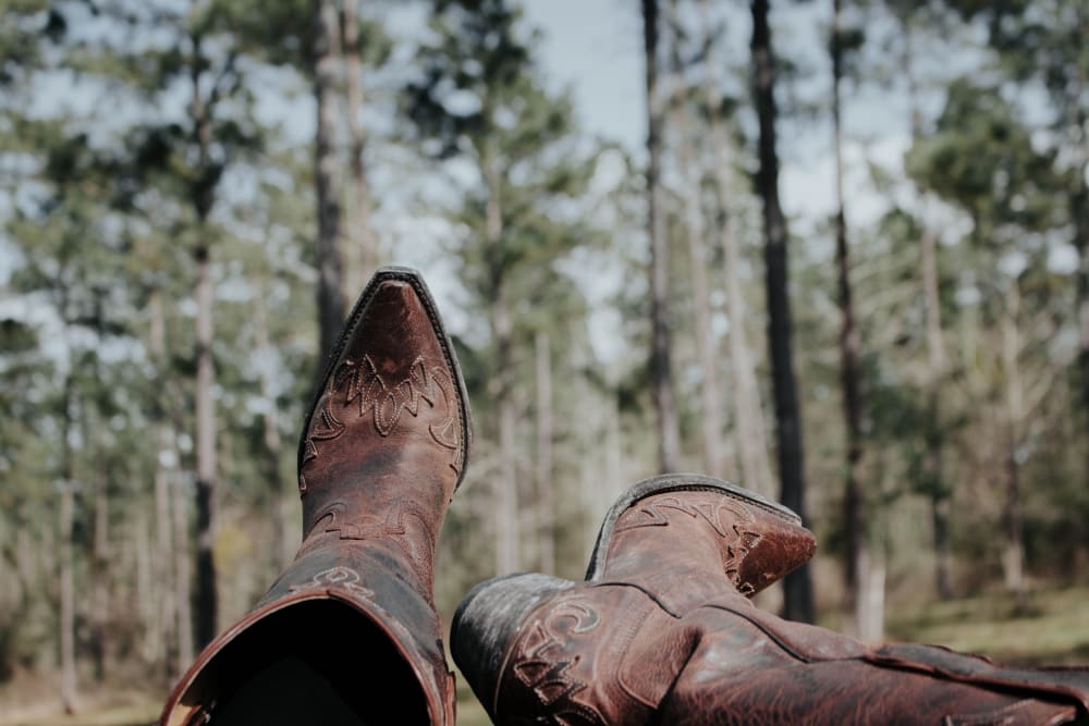 Boots and trees near Ivy Row at South in Mobile, Alabama