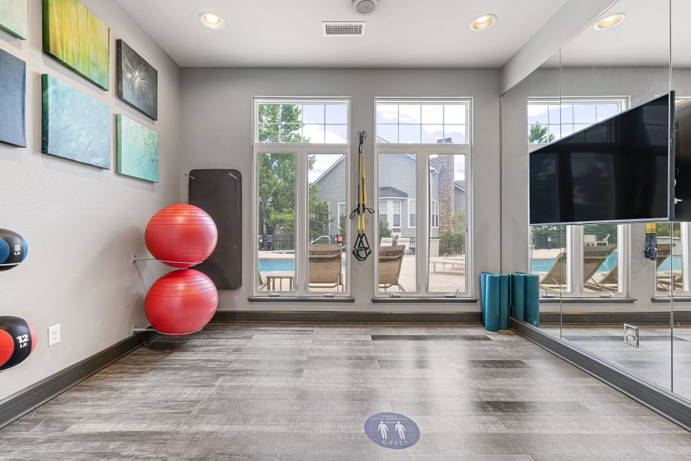 Yoga balls and large mirror in fitness center at Marquis Castle Pines in Castle Pines, Colorado