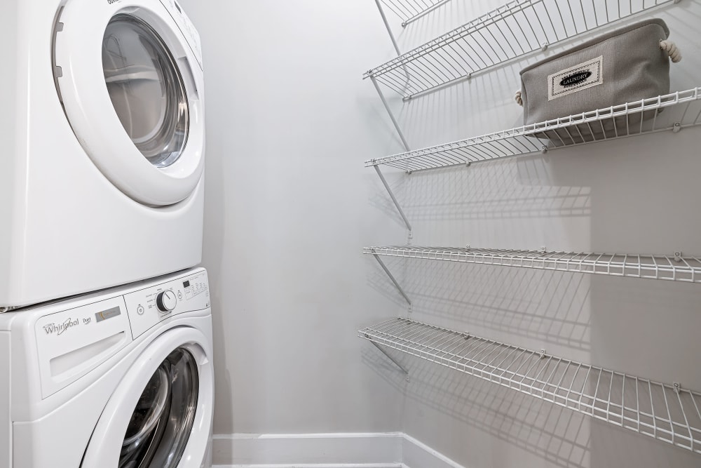 Laundry area with shelving at Marquis at Buckhead in Atlanta, Georgia