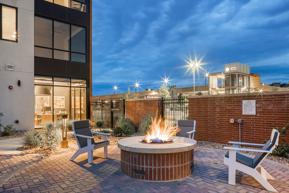 Outdoor seating with fire pit at Marq Iliff Station in Aurora, Colorado