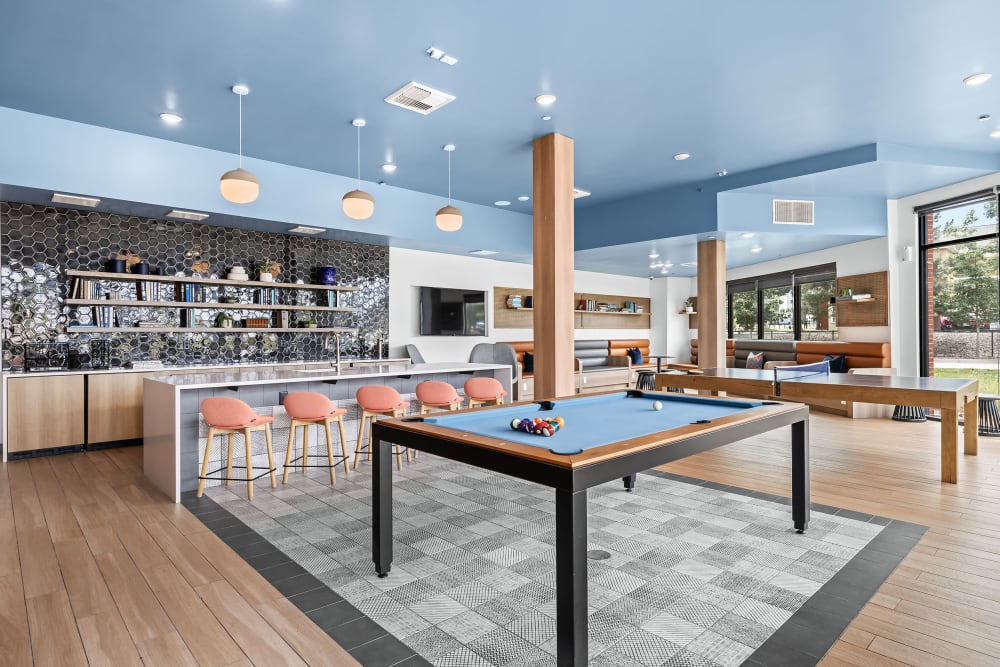 Recreation room with bar at Marq Iliff Station in Aurora, Colorado