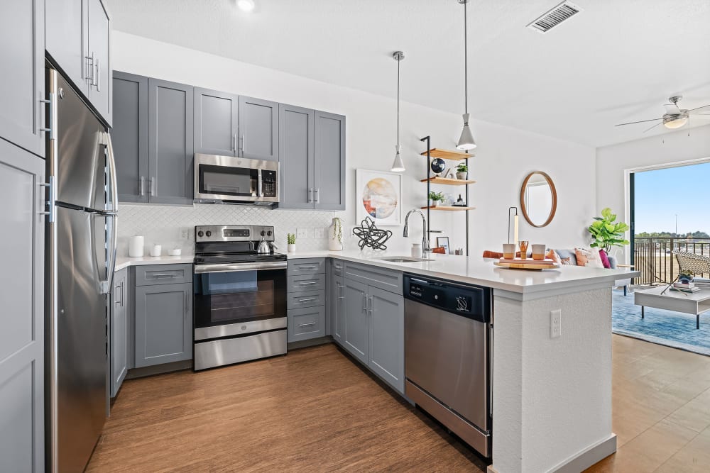Kitchen with stainless steel appliances at Marq Iliff Station in Aurora, Colorado