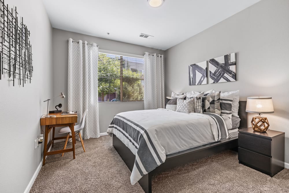 Bright bedroom with window at Marq Inverness in Englewood, Colorado