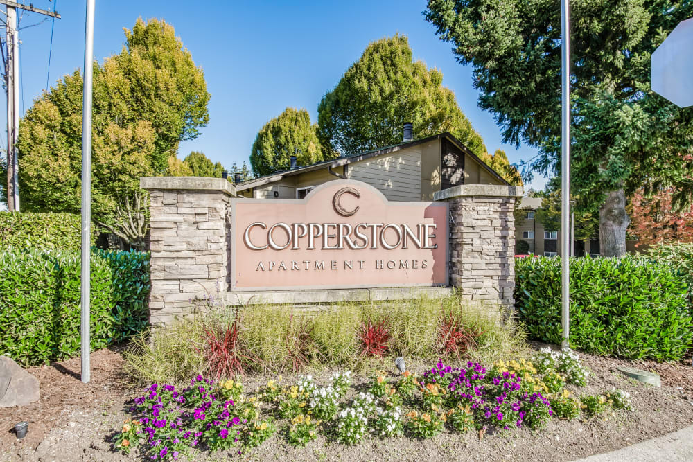 Community sign and entrance to Copperstone Apartment Homes in Everett, WA