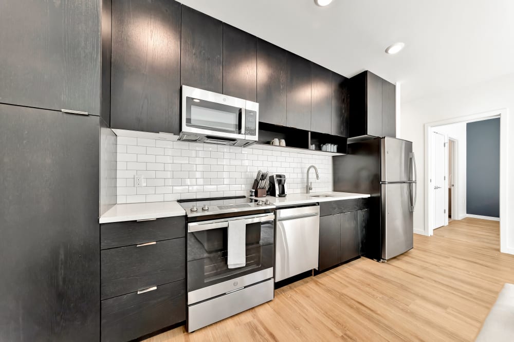 Kitchen with ample storage space and stainless steel appliances at The Robert in Portland, Oregon