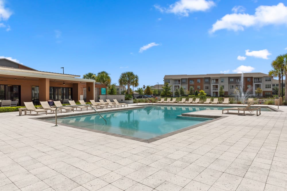 Resort-style swimming pool and poolside cabanas at The Point at Town Center in Jacksonville, Florida