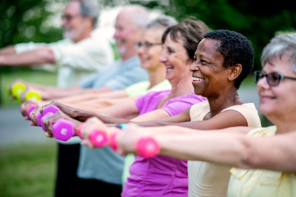 Outdoor fitness class with weights at Keystone Place at Magnolia Commons in Glen Carbon, Illinois