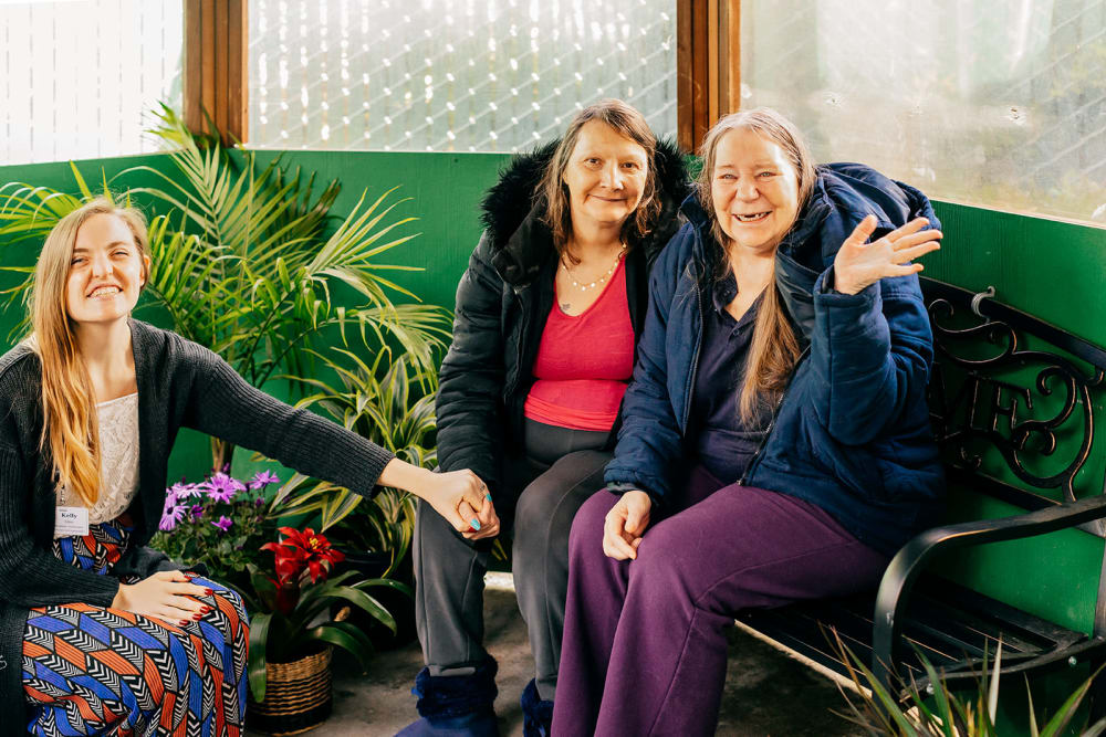 Residents and caregiver at Cascade Park Gardens Memory Care in Tacoma, Washington