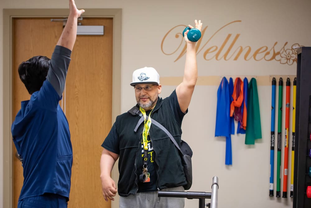 Arm strength training at Cascade Park Adult Day Health in Tacoma, Washington