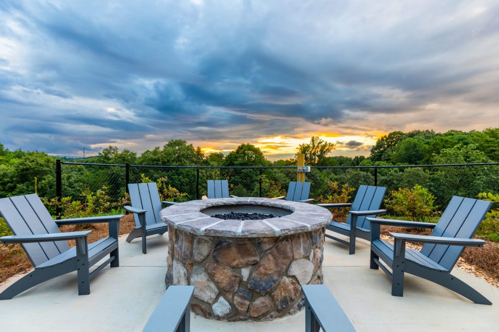Firepit with lounge chairs at The Holston | Apartments in Weaverville, North Carolina