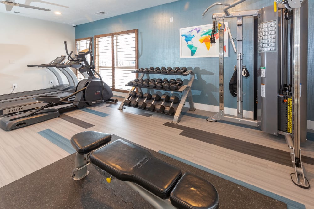 Fitness center with plenty of individual workout stations at Royal Ridge Apartments in Midvale, Utah