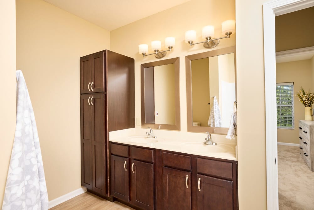 Cabinet space and a double sink in an apartment bathroom at Legacy Living Florence in Florence, Kentucky