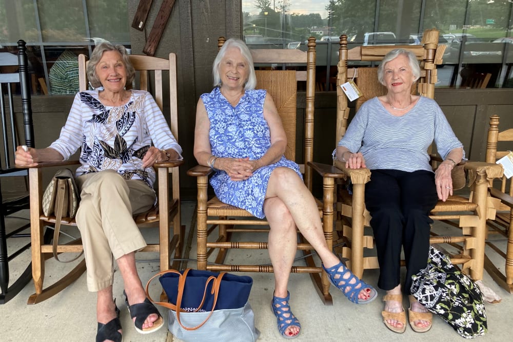 three resident women sitting on the porch at The Clinton Presbyterian Community in Clinton, South Carolina