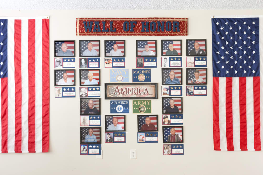 A wall of honor for veteran residents at Carriage Inn Lake Jackson in Lake Jackson, Texas