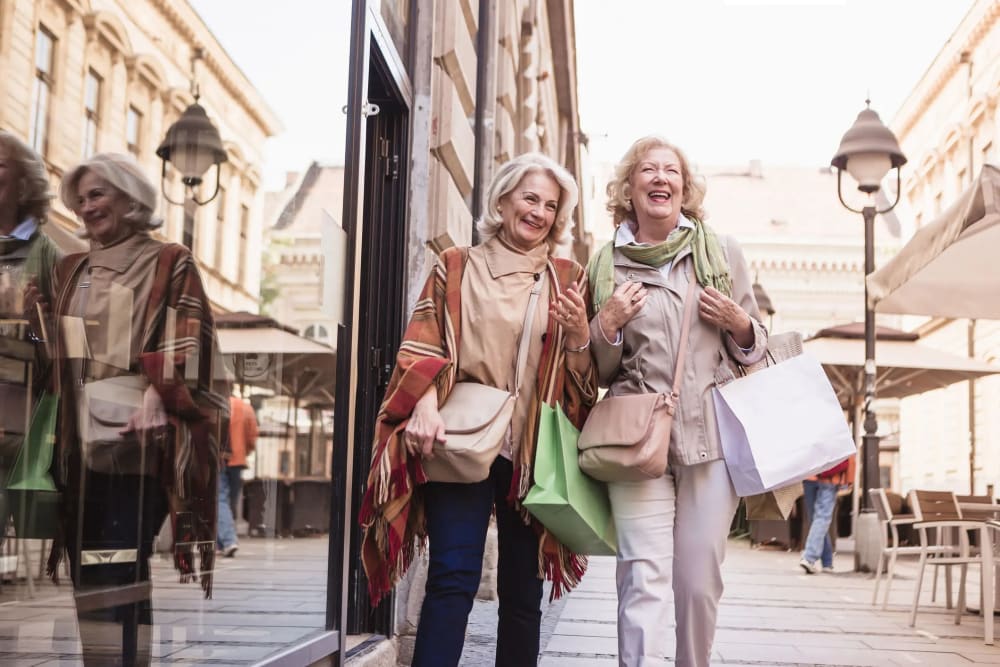 Residents walking outside at Village on the Park Friendswood in Friendswood, Texas