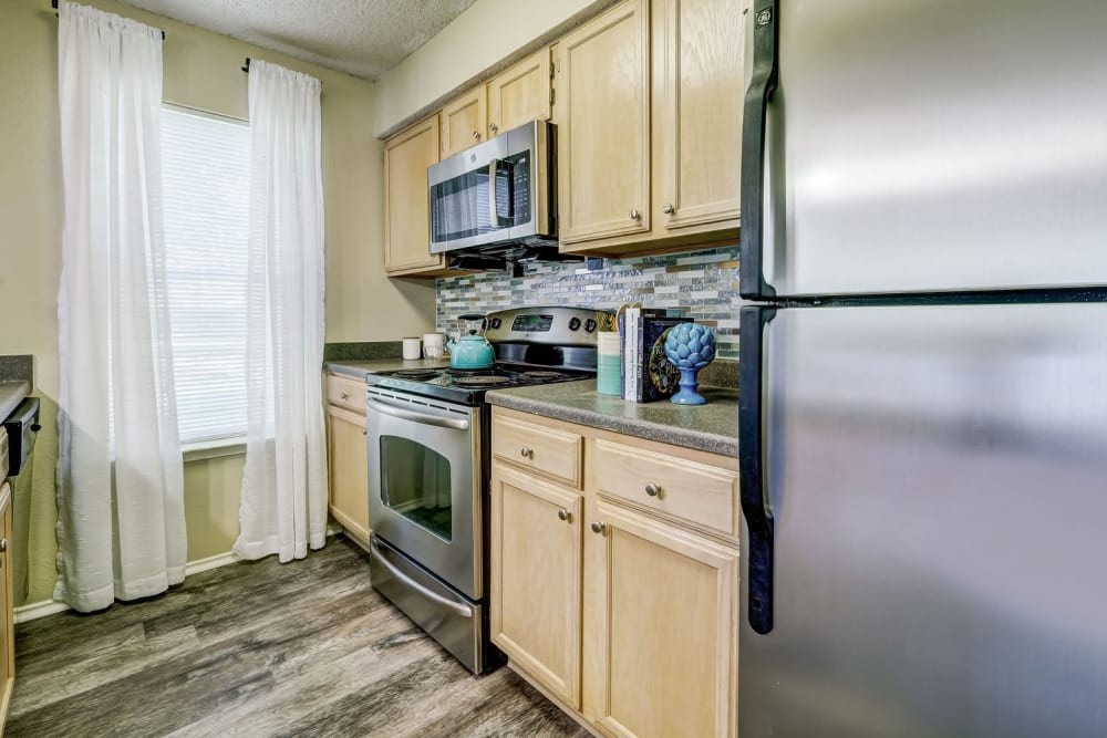 Kitchen with stainless steel appliances at Club at North Hills in Pittsburgh, Pennsylvania