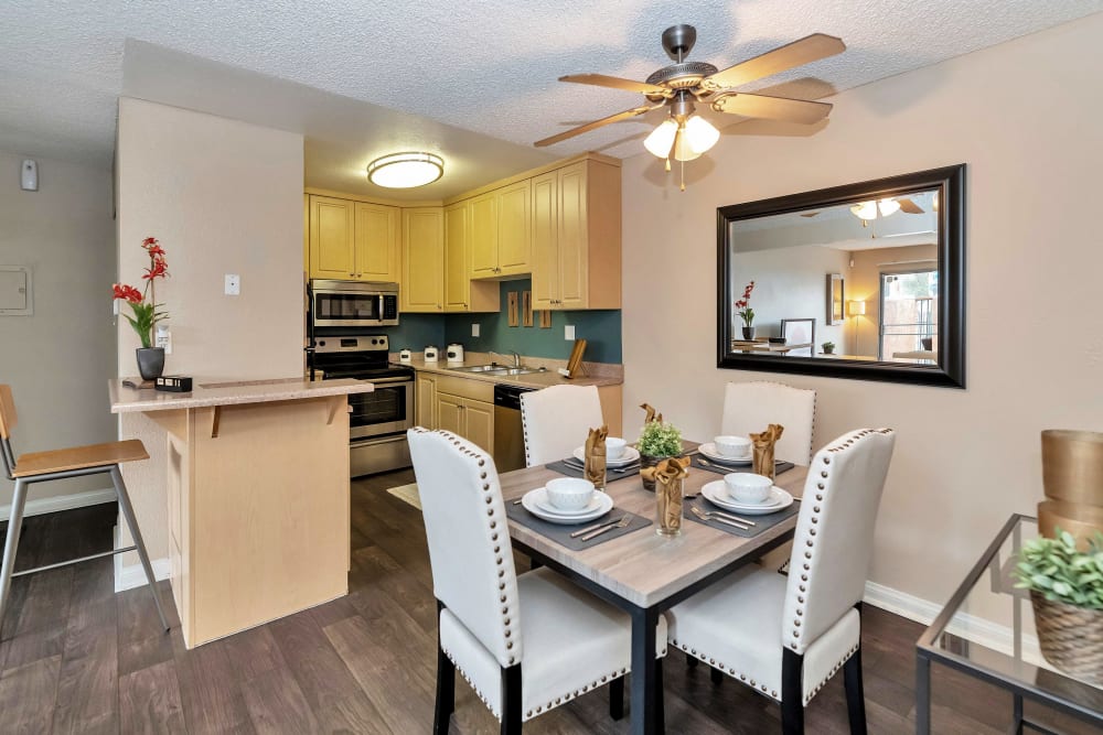 Apartment with dinning area and wood-style flooring at Colter Park, Phoenix, Arizona 