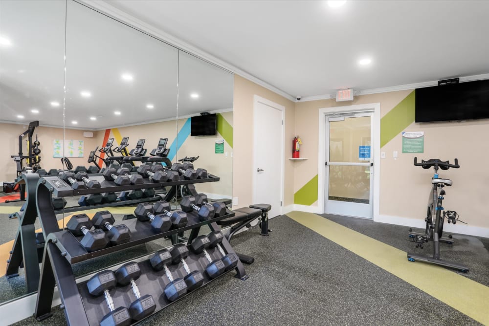 Free weights in the fitness center at Kensington Manor Apartments in Farmington, Michigan