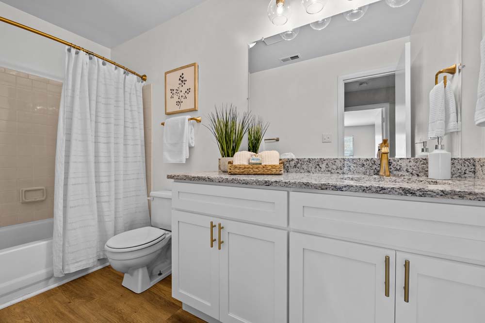 Bathroom with granite countertops at Runaway Bay Apartments in Virginia Beach, Virginia